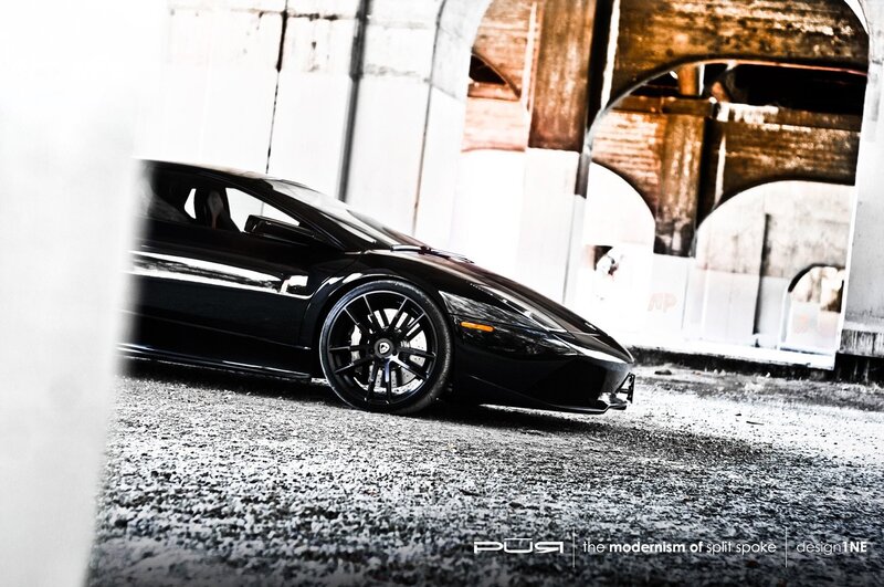 Black sports car under bridge
