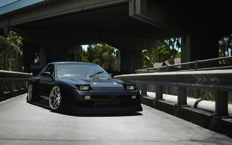 black sports car under overpass