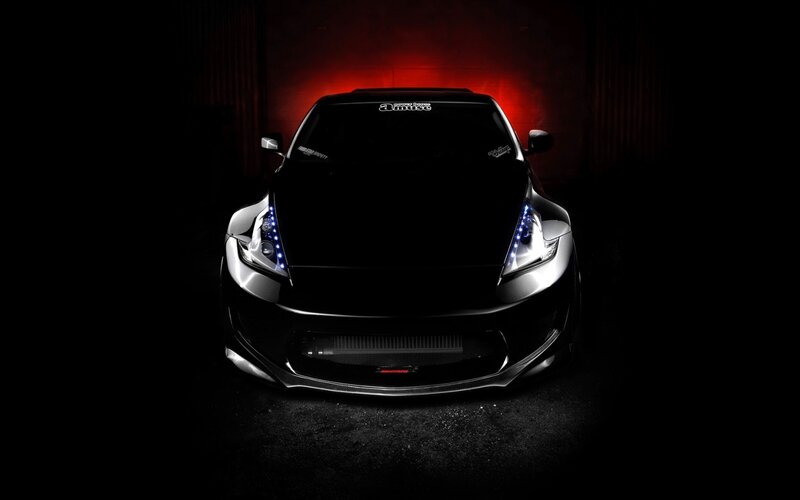 black sports car with blue lights