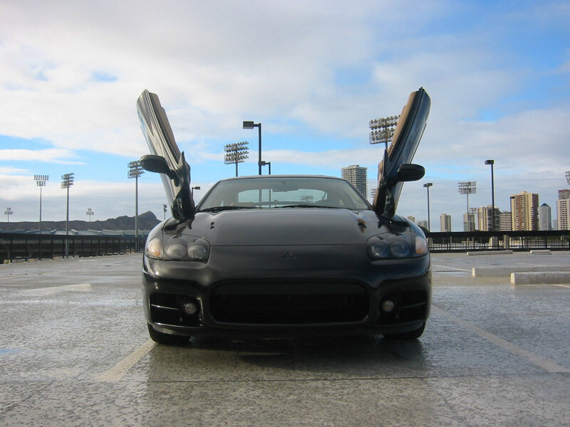 Black sports car with doors open