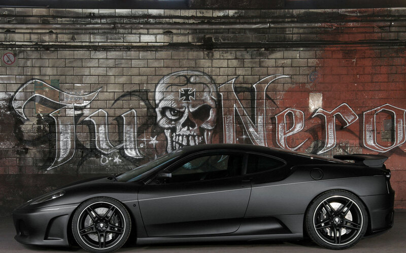 Black sports car with graffiti