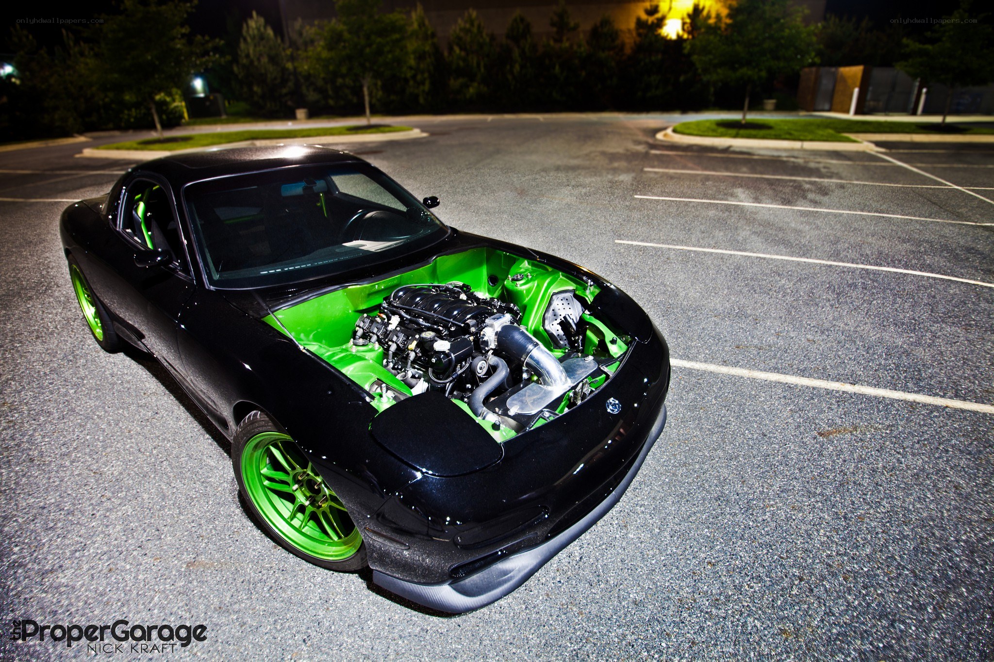 black sports car with green engine