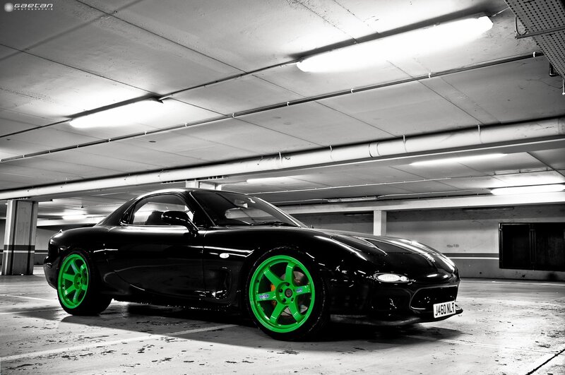 black sports car with green wheels