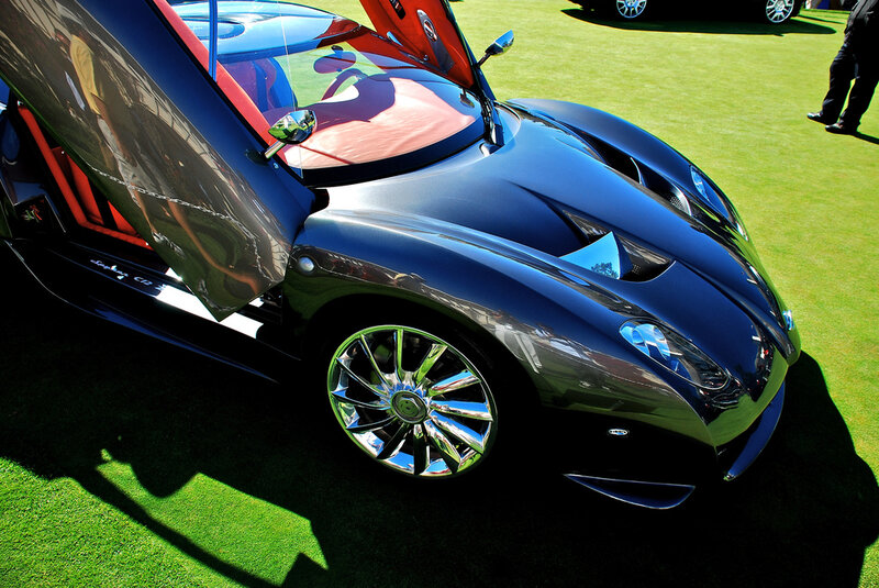 Black sports car with open door