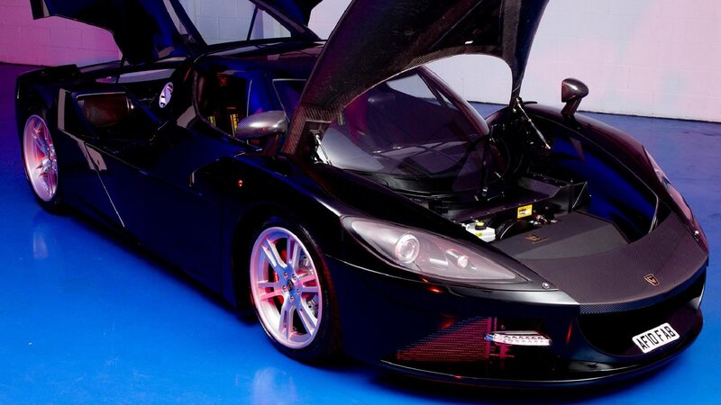 black sports car with open doors