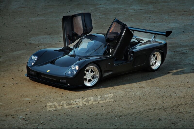 Black sports car with open doors