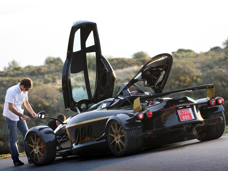 Black sports car with open doors
