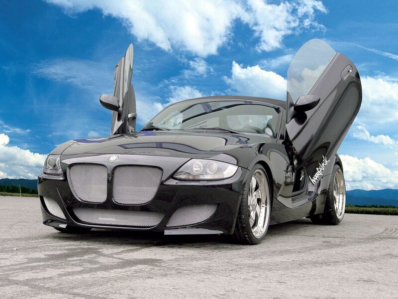 Black sports car with open doors