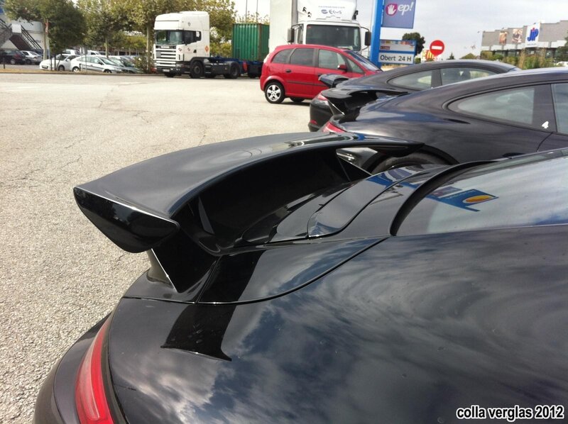 black sports car with rear wing
