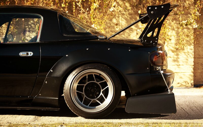black sports car with rear wing