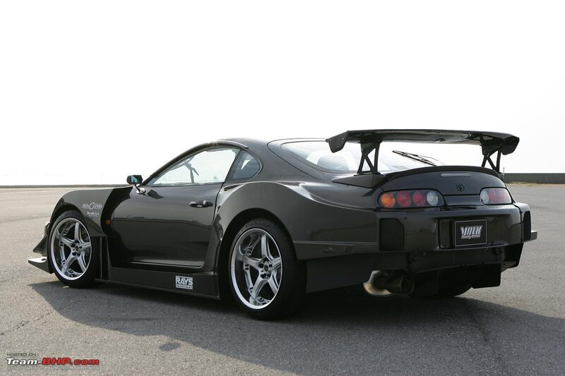 black sports car with rear wing