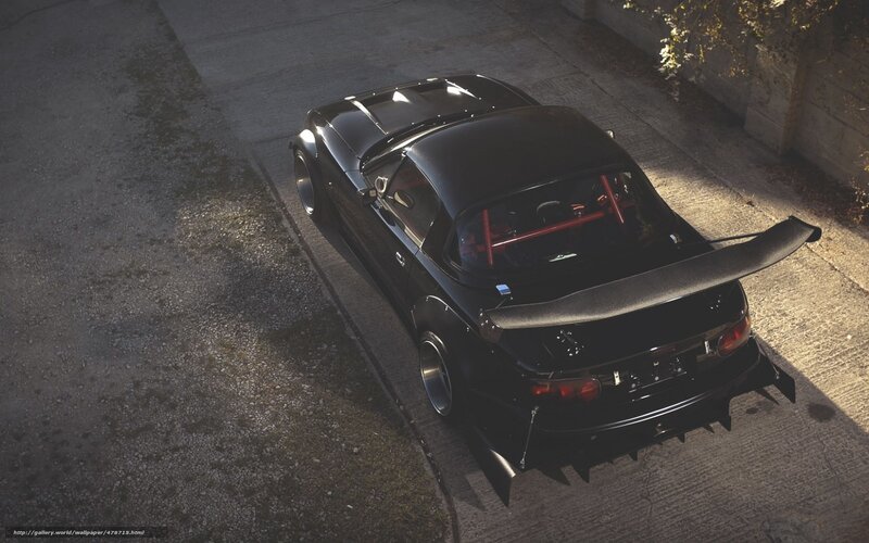 black sports car with rear wing