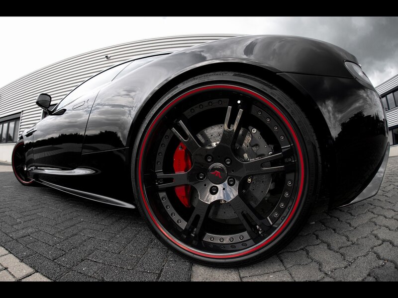 black sports car with red wheels