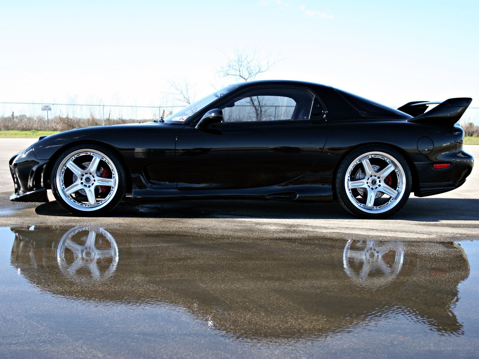 Black sports car with reflection