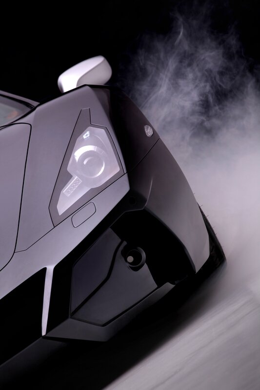 Black sports car with smoke