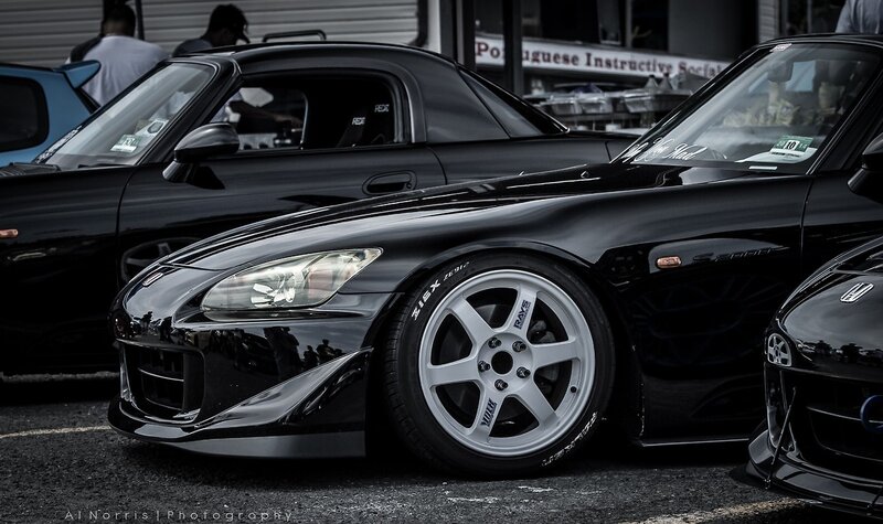 Black sports cars at a car show