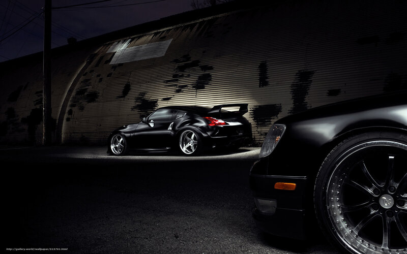 Black sports cars at night