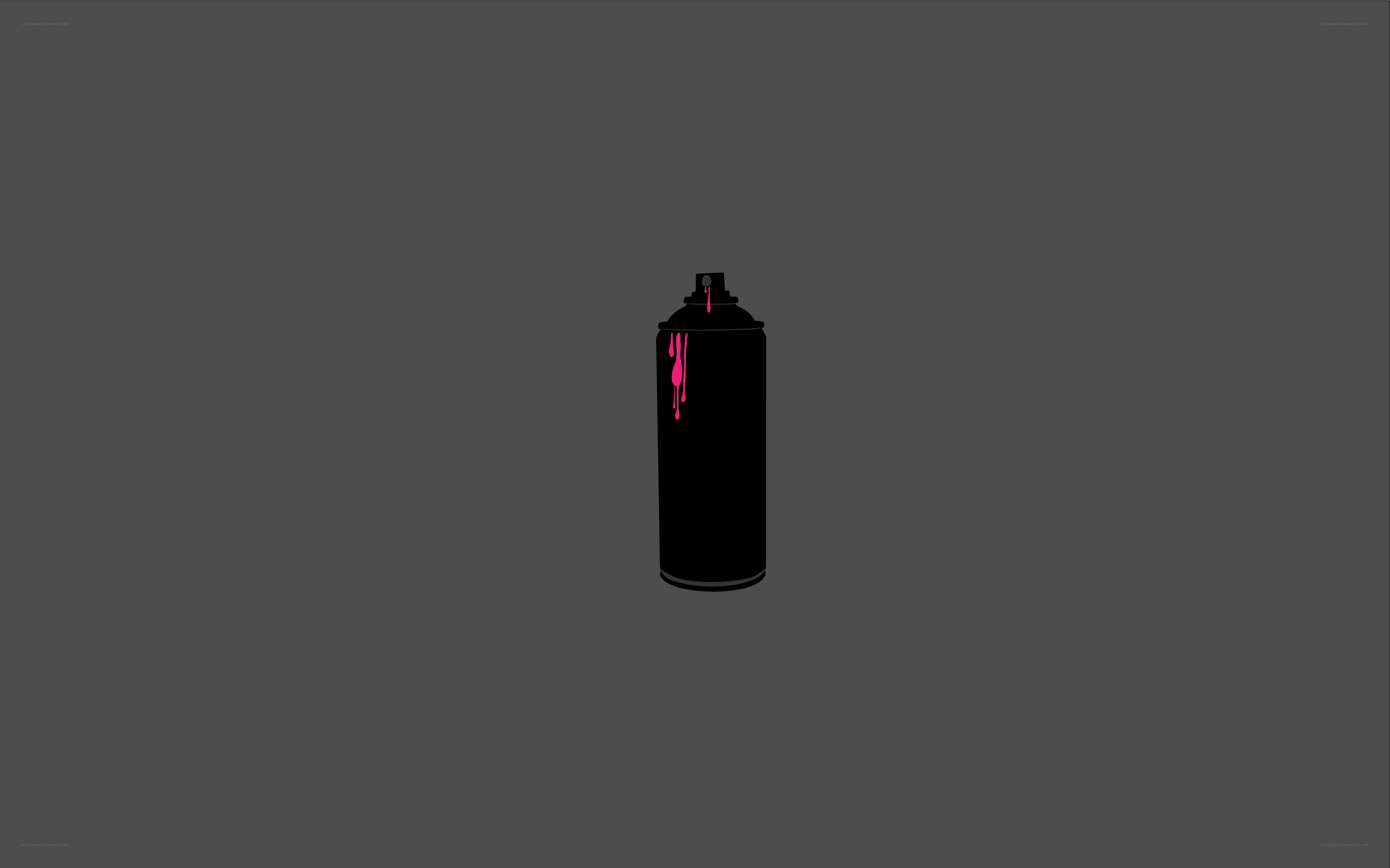 black spray can with pink paint