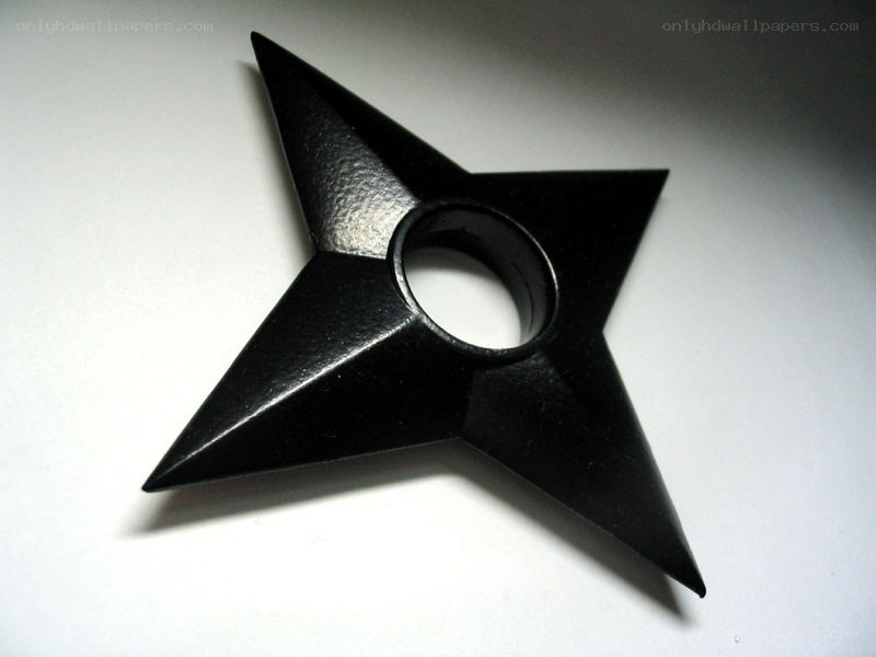 black star-shaped shuriken