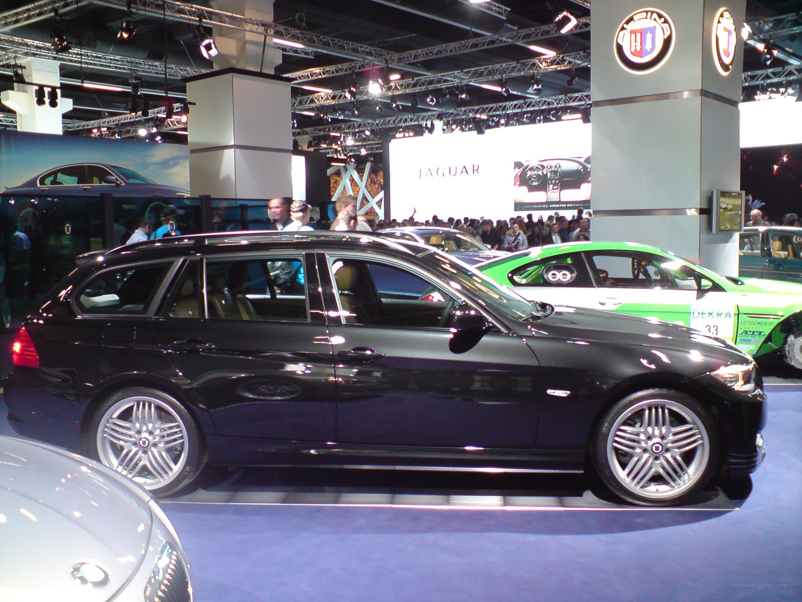 Black station wagon at auto show