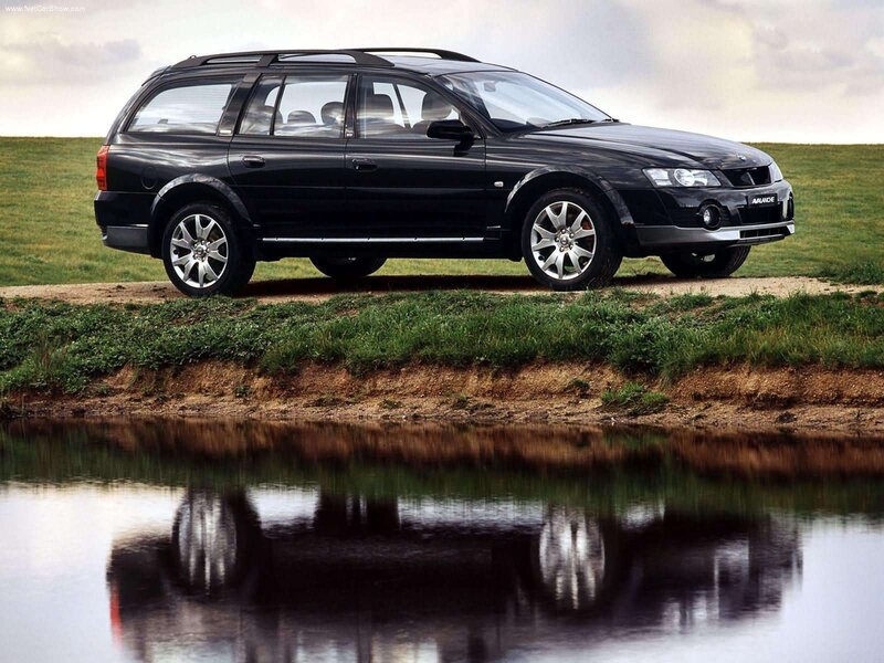 black station wagon by water