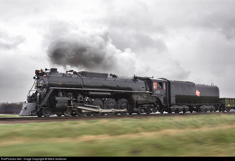 Black steam locomotive in motion