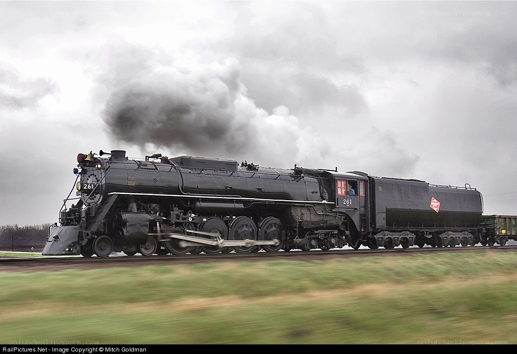 Black steam locomotive in motion
