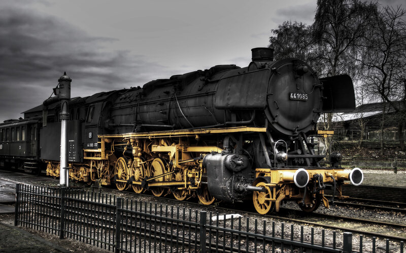 black steam locomotive on tracks