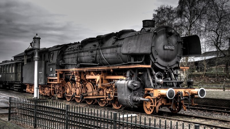 Black steam locomotive on tracks