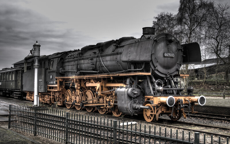 Black steam locomotive on tracks