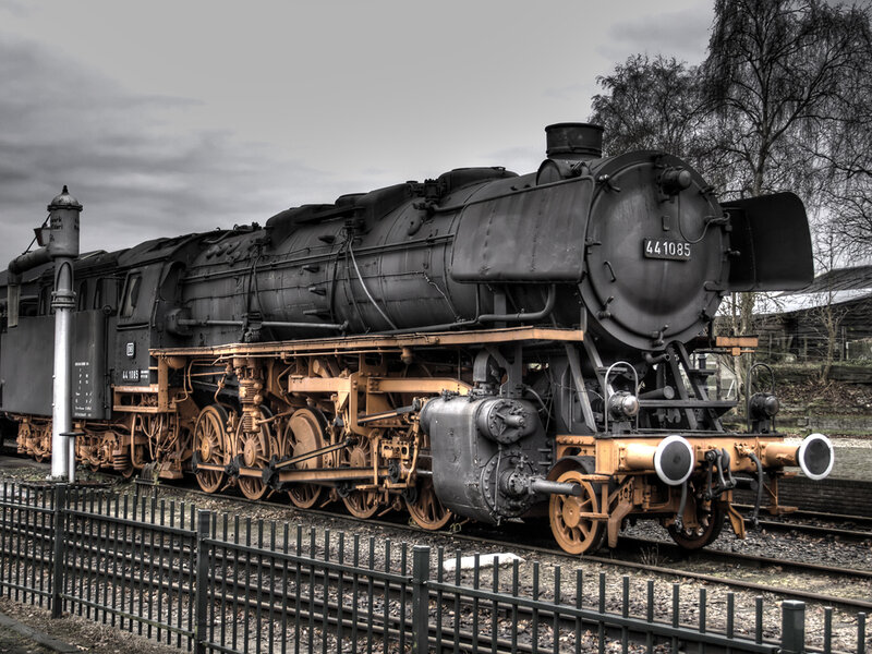 Black steam locomotive on tracks