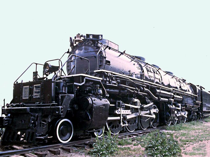 Black steam locomotive on tracks