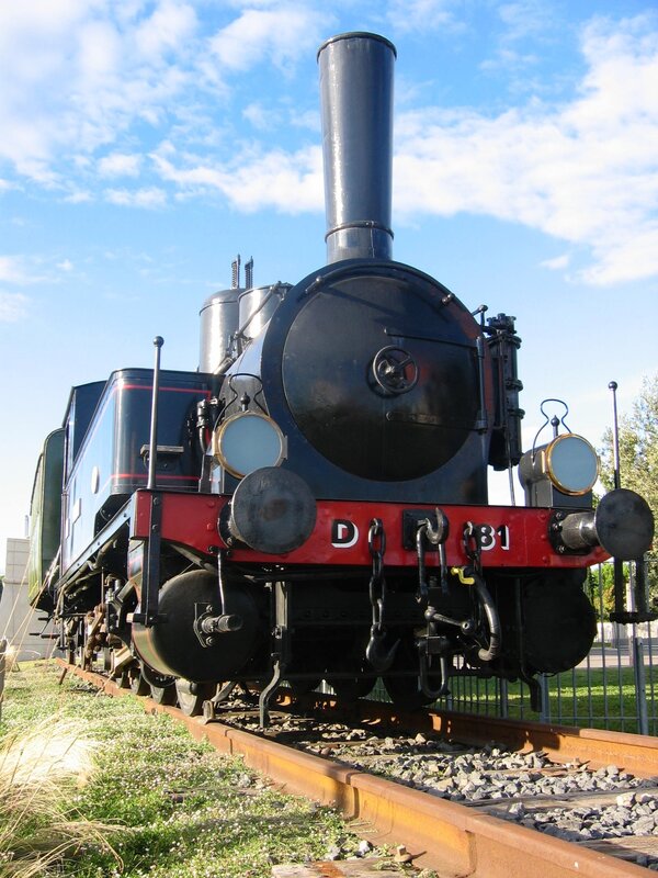 Black steam locomotive on tracks