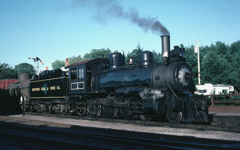 Black steam locomotive on tracks