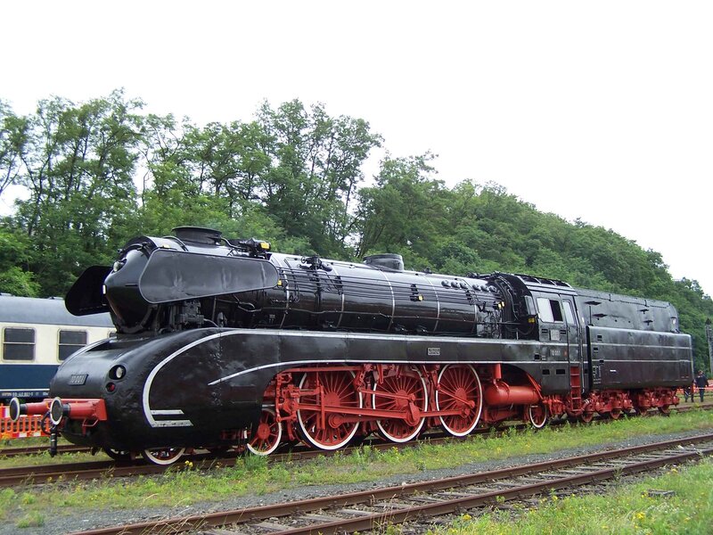 Black steam locomotive on tracks