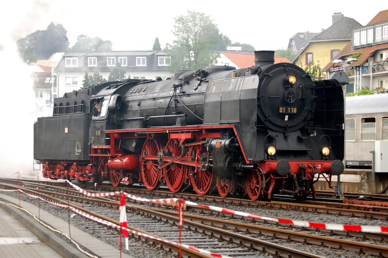 Black steam locomotive on tracks
