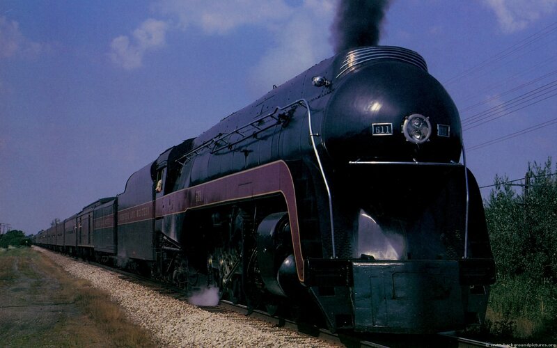 Black steam locomotive pulling train