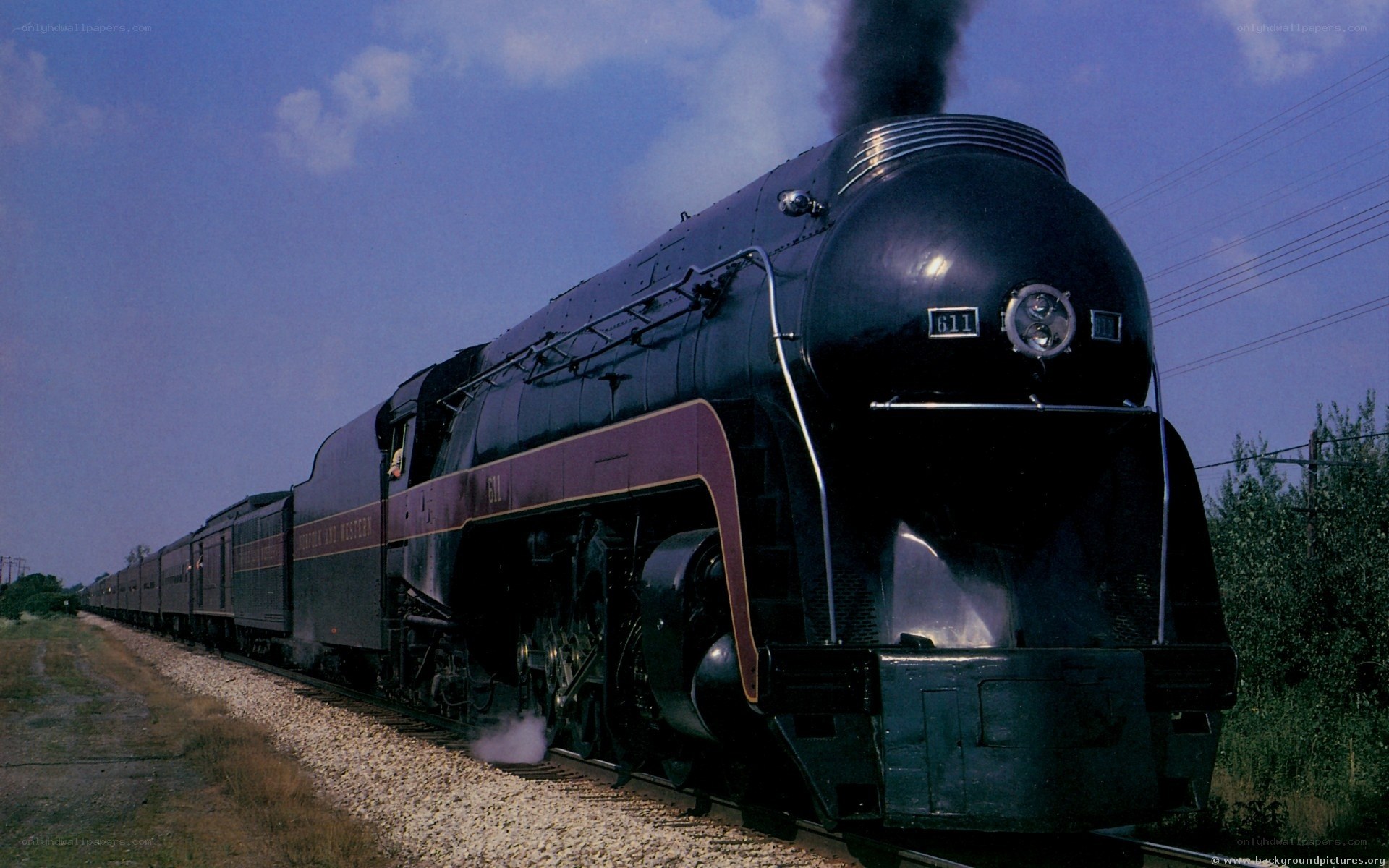 Black steam locomotive pulling train