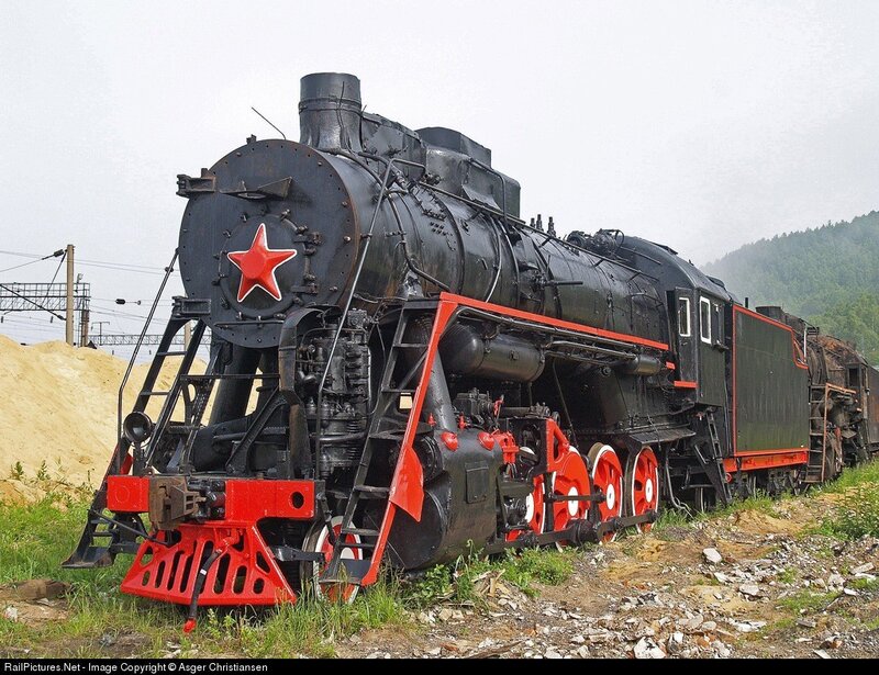 Black steam locomotive with red star