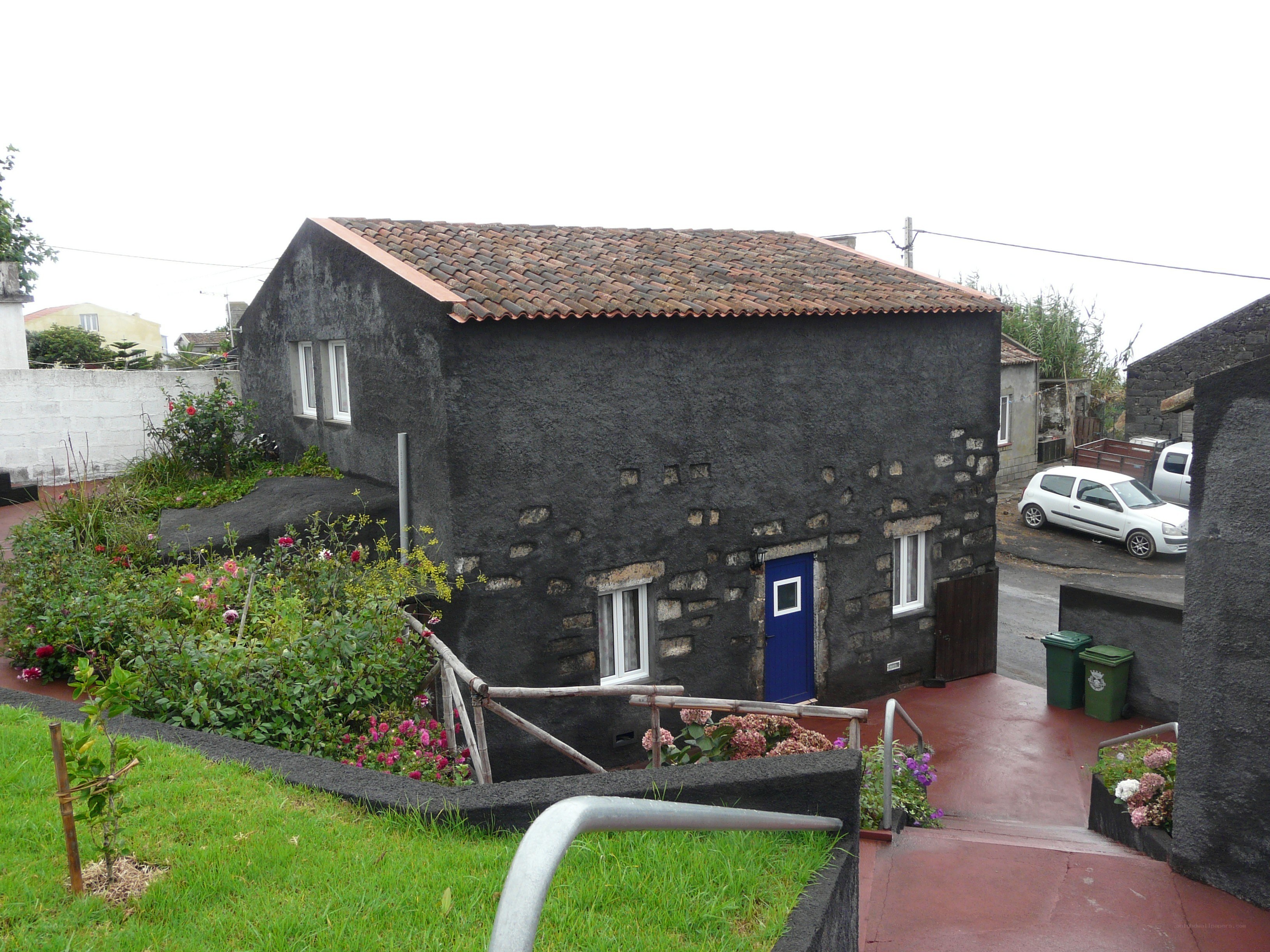 Black stone house with garden