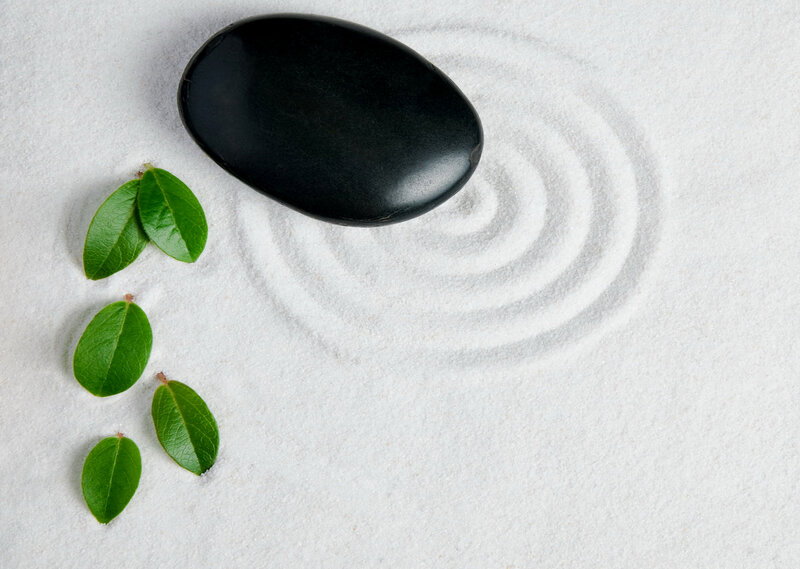 Black Stone in Sand