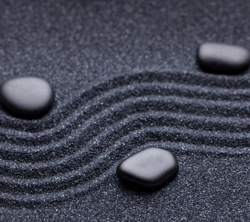Black Stones in Sand