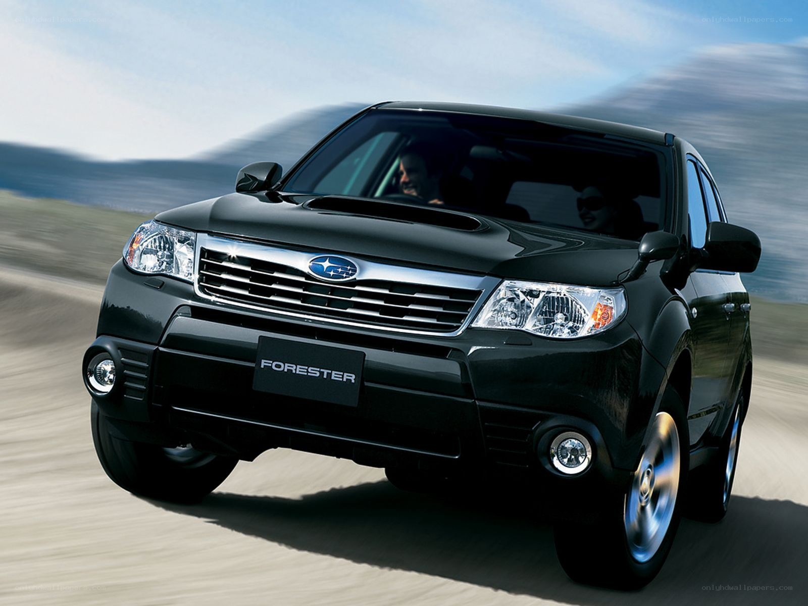 Black Subaru Forester in motion