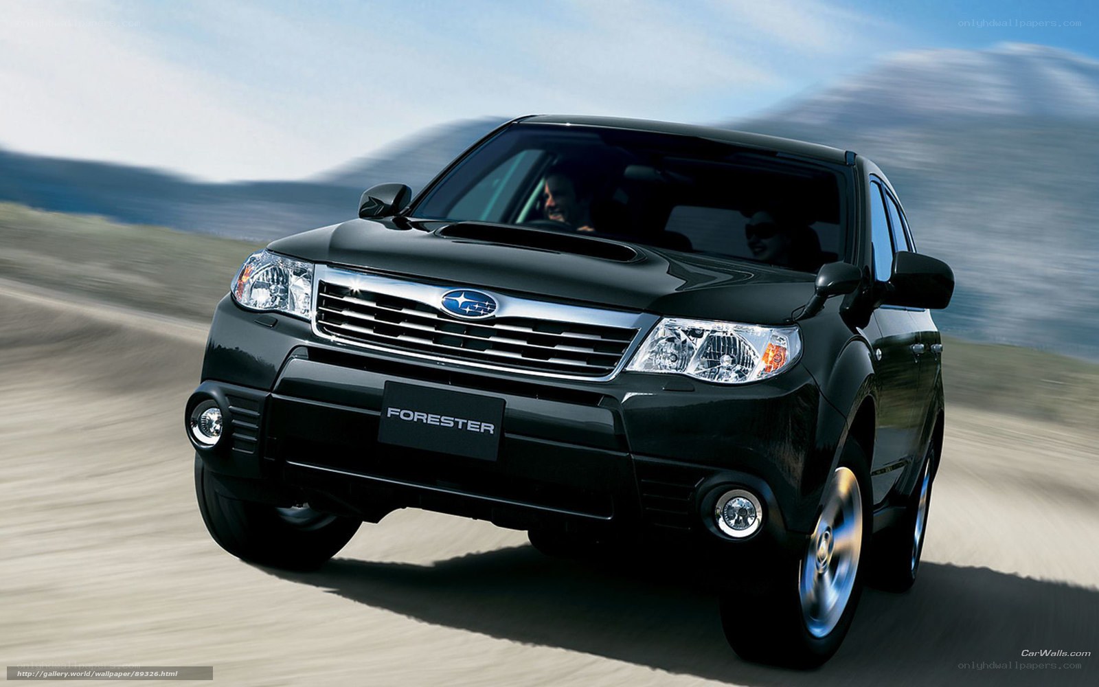 Black Subaru Forester in motion