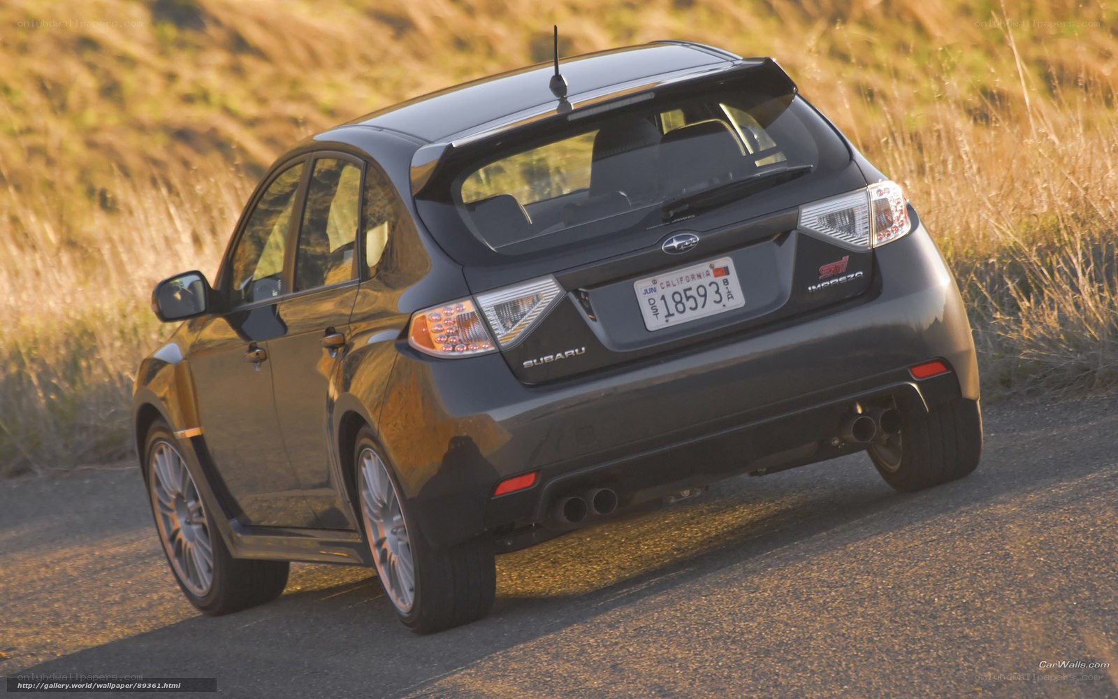 black subaru impreza on road