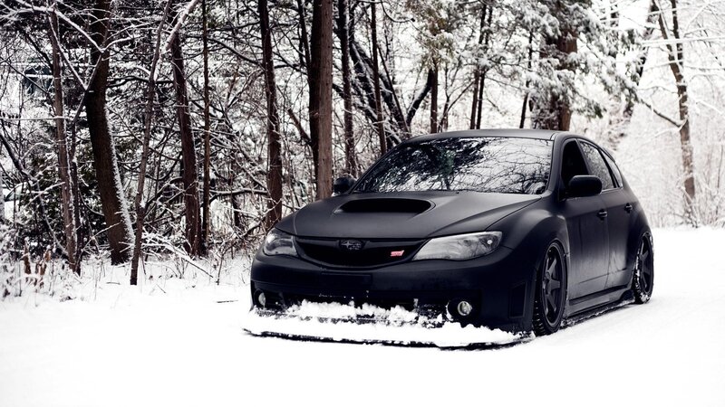 Black Subaru in Snow