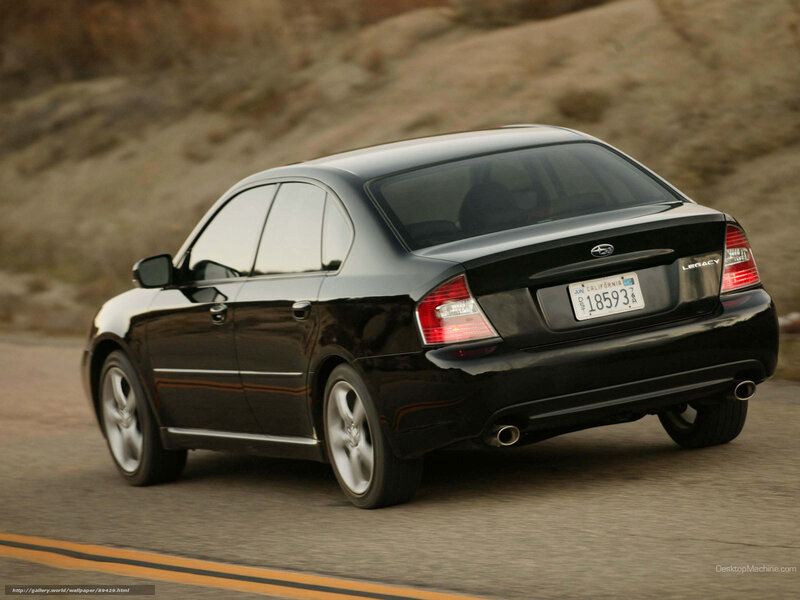 black subaru legacy driving