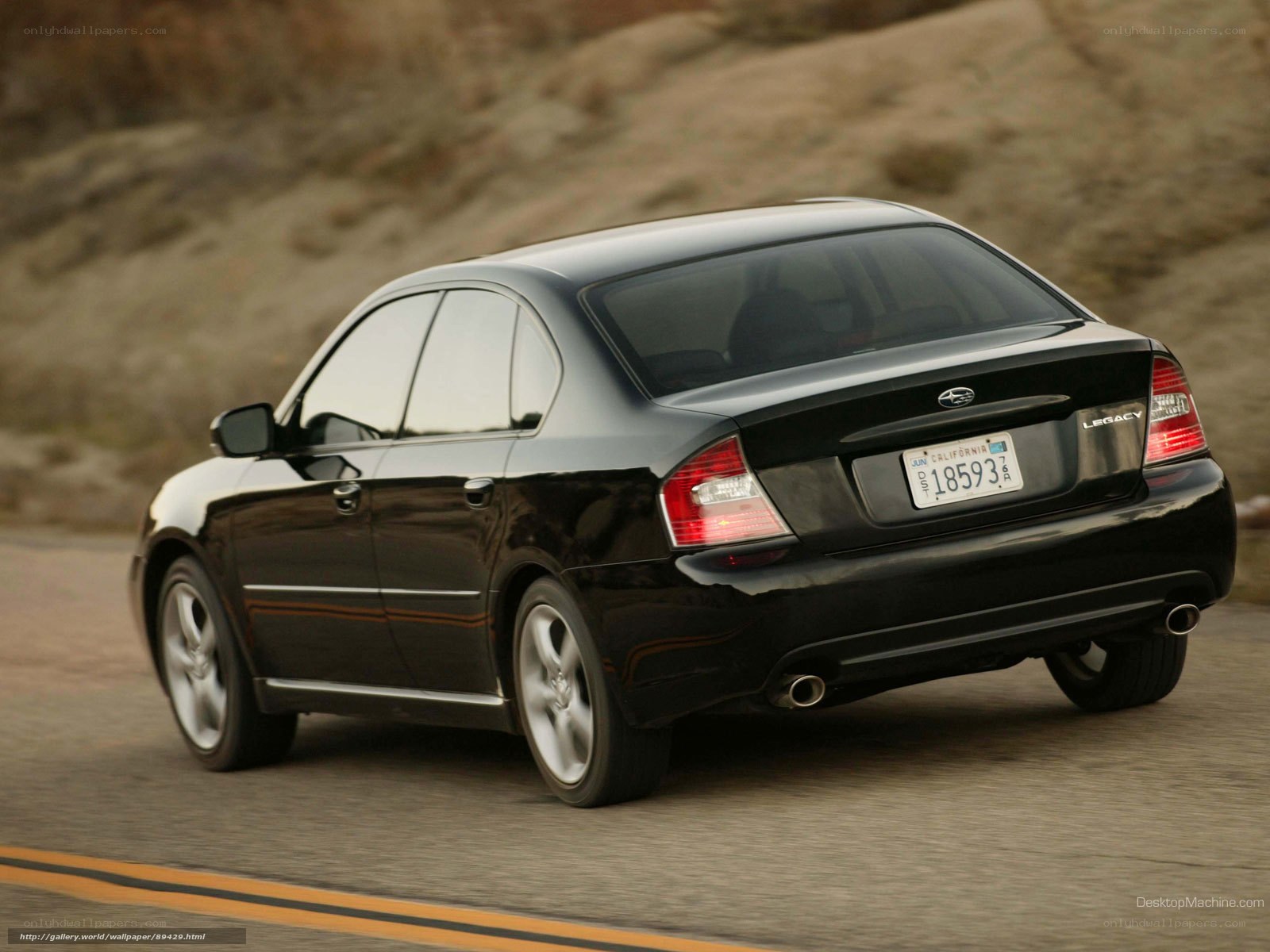 black subaru legacy driving