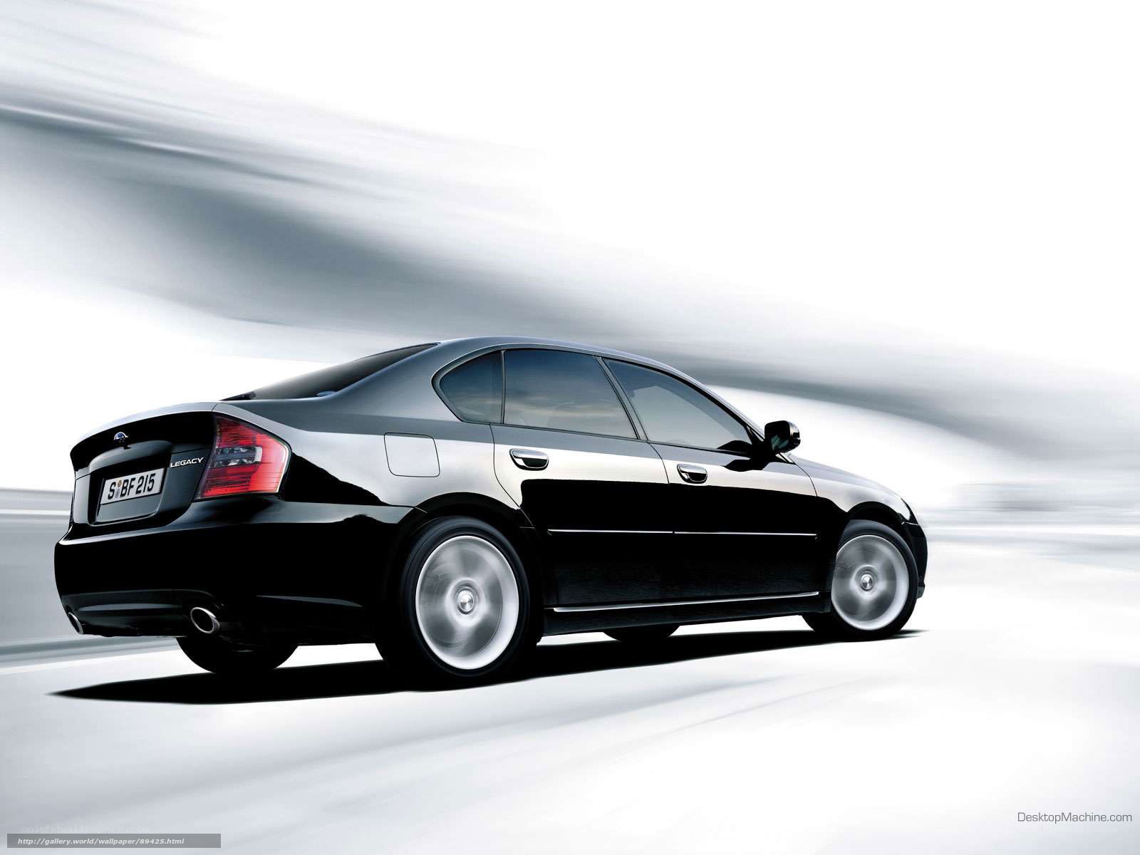 black subaru legacy in motion