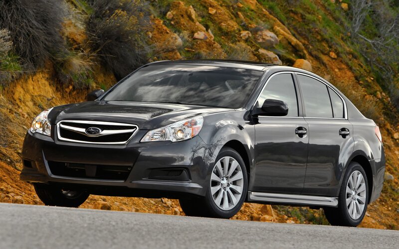 Black Subaru Legacy on a road